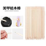 Dual-ended orange wood stick for nail art, nail art dotting tool, beechwood stick, beauty wood stick, cuticle pusher, and nail gap cleaner.