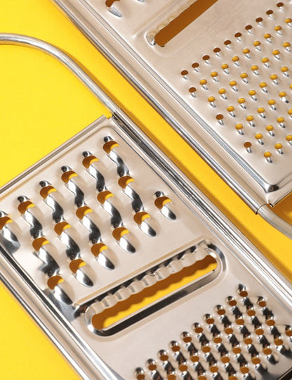 Stainless steel grater can be placed on the basin to cut shreds and slices. Multifunctional peeler and peeling tool. Stainless steel peeler. Multifunctional peeling knife. Grater. Peeler. Potato apple peeling knife.