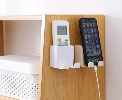 Wall-mounted remote control storage box, mobile phone charging bracket, punch-free power cord socket storage rack, desk and wire storage